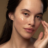 Model applying Antipodes Baptise H2O Ultra Hydrating Water Gel on face