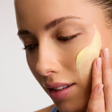 Model applying Antipodes Ceramide Souffle Fresh Hydration Cream on face