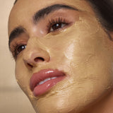 Model wearing Antipodes Manuka honey face mask with glowing skin