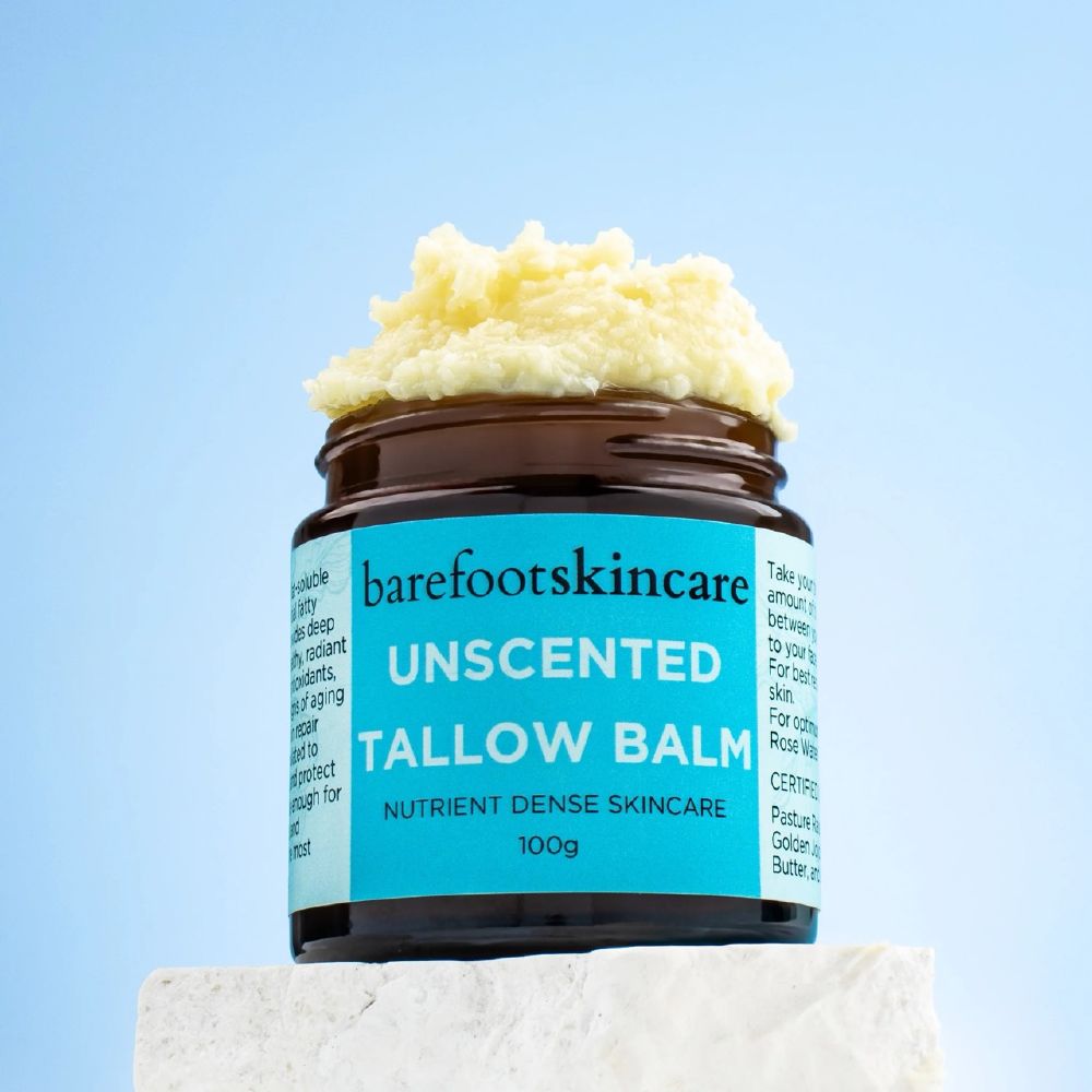 Open jar of Barefoot Skincare Unscented Tallow Balm showing whipped balm texture on top