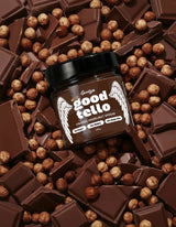 Gevity Rx Hazelnut Spread GOODTELLO 200g jar placed on a background of chocolate pieces and whole hazelnuts.